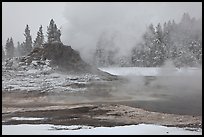 Castle geyser cone and steam in winter. Yellowstone National Park, Wyoming, USA. (color)