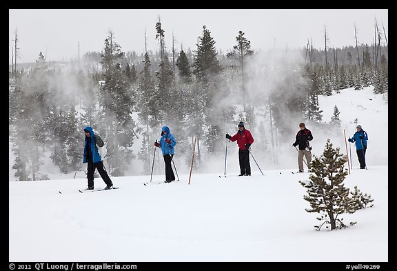 Skiers and thermal steam. Yellowstone National Park, Wyoming, USA.