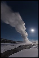 Night view of Old Faithful Geyser in winter with full moon. Yellowstone National Park ( color)