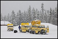 Snowcoaches and snow falling. Yellowstone National Park, Wyoming, USA. (color)