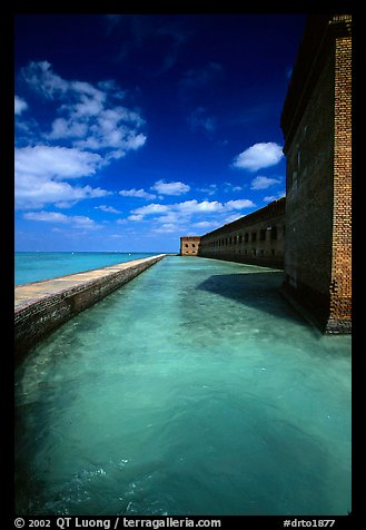Fort Jefferson moat and massive brick wall on a sunny dayl. Dry Tortugas National Park, Florida, USA.