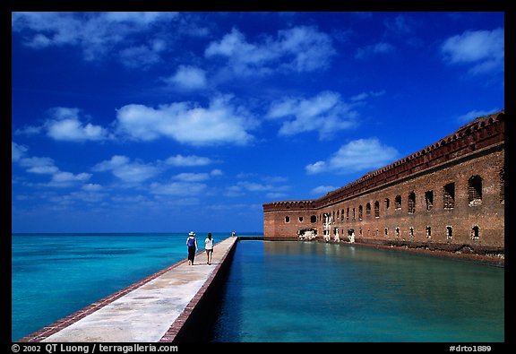 Tourists stroll on the seawall. Dry Tortugas National Park (color)
