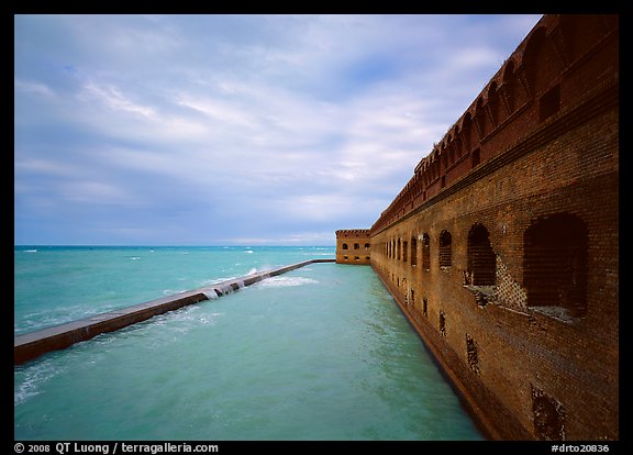 Fort Jefferson massive brick wall overlooking the ocean, cloudy weather. Dry Tortugas National Park (color)