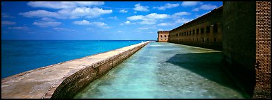 Seawall, moat, and Fort Jefferson. Dry Tortugas  National Park (Panoramic color)