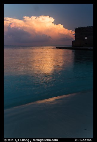 Beach, cloud and fort at sunrise. Dry Tortugas National Park, Florida, USA.