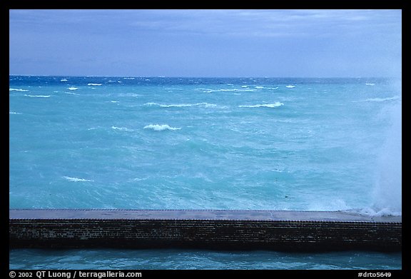Seawall battered by surf on a stormy day. Dry Tortugas National Park, Florida, USA.