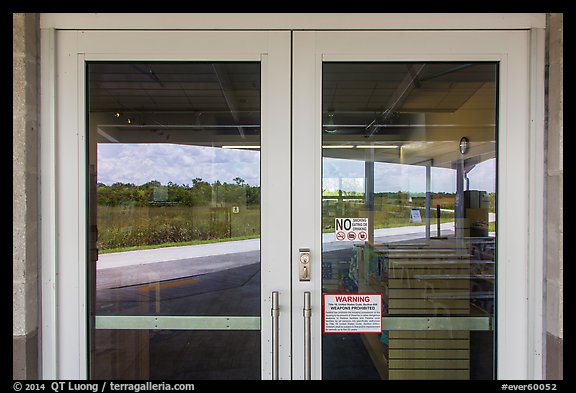 Road and slough, Shark Valley visitor center window reflexion. Everglades National Park, Florida, USA.