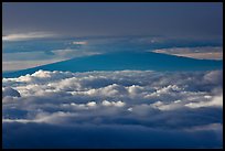 Mauna Kea between clouds, seen from Halekala summit. Haleakala National Park, Hawaii, USA. (color)