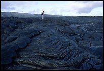 Hiker on hardened lava flow at the end of Chain of Craters road. Hawaii Volcanoes National Park ( color)