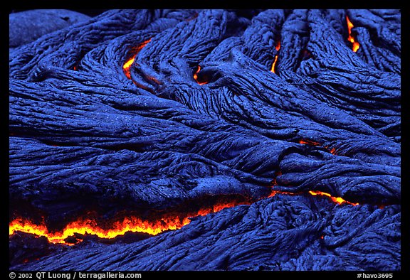 Close-up of ripples of flowing pahoehoe lava at dusk. Hawaii Volcanoes National Park (color)