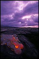 Live lava glows at dawn on coastal plain. Hawaii Volcanoes National Park ( color)