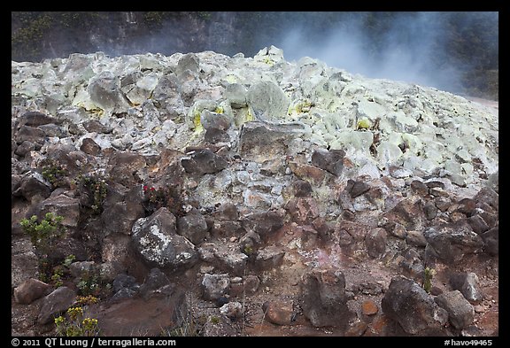 Mound of rocks covered with sulphur from vent. Hawaii Volcanoes National Park, Hawaii, USA.