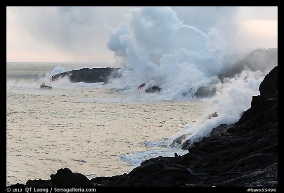 Steam rising off lava flowing into ocean. Hawaii Volcanoes National Park (color)