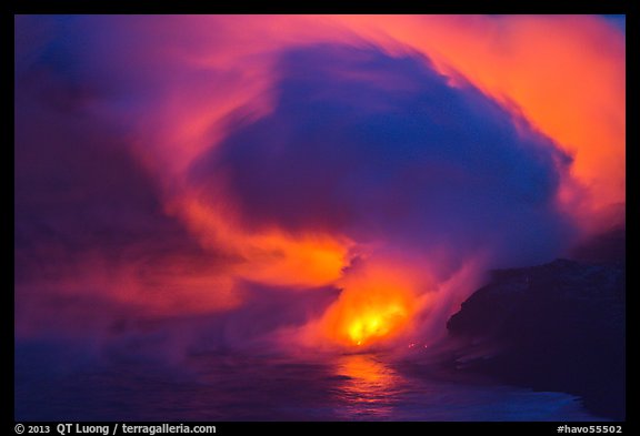 Lava steam swirls above ocean at dusk. Hawaii Volcanoes National Park, Hawaii, USA.