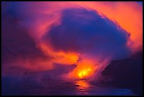 Lava steam swirls above ocean at dusk. Hawaii Volcanoes National Park, Hawaii, USA.