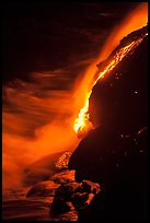 Lava flow entering Pacific Ocean at night. Hawaii Volcanoes National Park ( color)