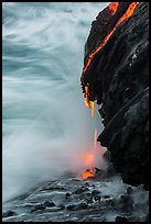 Molten lava drips into the sea. Hawaii Volcanoes National Park ( color)