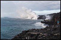 Hiker and volcanic steam cloud on coast. Hawaii Volcanoes National Park ( color)