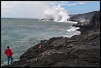 Park visitor looking, lava ocean entry plume. Hawaii Volcanoes National Park, Hawaii, USA. (color)