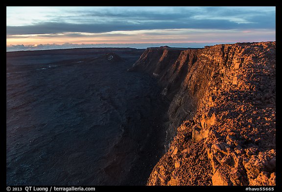 Cliffs bordering Mauna Loa summit caldera from rim at sunrise. Hawaii Volcanoes National Park, Hawaii, USA.