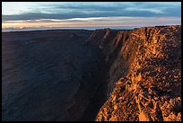 Cliffs bordering Mauna Loa summit caldera from rim at sunrise. Hawaii Volcanoes National Park ( color)