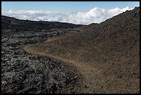 Trail through olivine hill bordering aa lava. Hawaii Volcanoes National Park ( color)