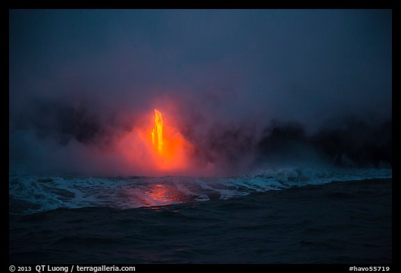 Lava flow at dawn, ocean reflection, and steam plume. Hawaii Volcanoes National Park, Hawaii, USA.