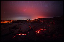 Molten lava flow with star trails. Hawaii Volcanoes National Park, Hawaii, USA.