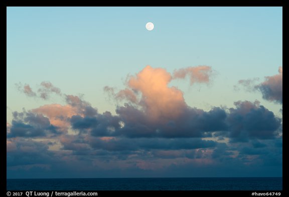 Moon, clouds and ocean, sunset. Hawaii Volcanoes National Park, Hawaii, USA.