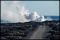 Byciclists and hikers approaching lava ocean entry on emergency road. Hawaii Volcanoes National Park ( color)