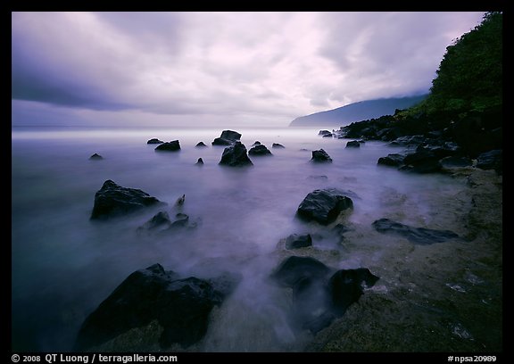 Seascape with smooth water, clouds and rocks, Siu Point, Tau Island. National Park of American Samoa (color)