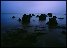 Rocks in water at dusk, Siu Point, Tau Island. National Park of American Samoa ( color)