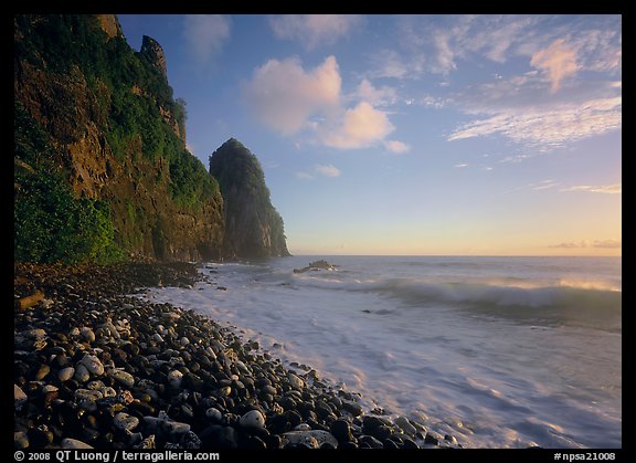 Beach with pebbles and Pola Island, early morning, Tutuila Island. National Park of American Samoa