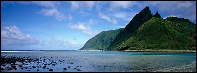 Pointed tropical peaks rising above turquoise waters, Ofu Island. National Park of American Samoa (Panoramic color)