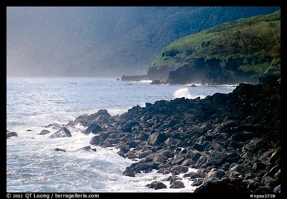 Coastline with Balsalt boulders on the wild South coast of Tau Island. National Park of American Samoa