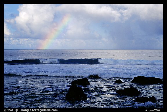 Rainbow and boulders, Siu Point, Tau Island. National Park of American Samoa