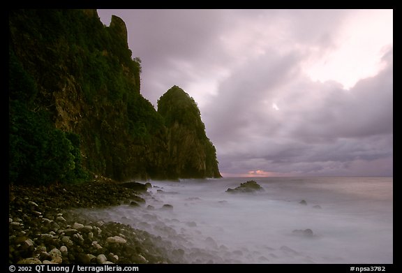 Peeble beach and Pola Island, stormy sunrise, Tutuila Island. National Park of American Samoa