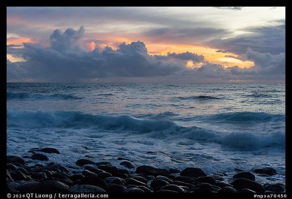 Boulders, surf, and clouds at sunrise. National Park of American Samoa