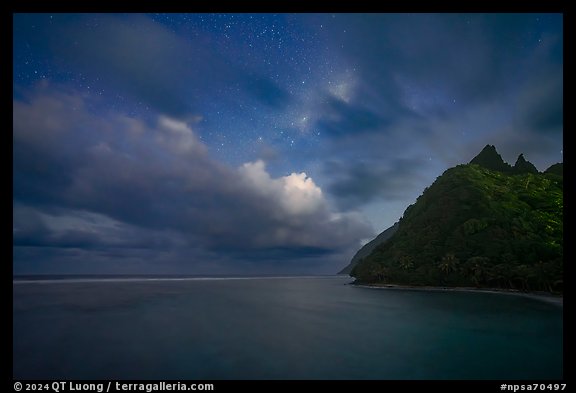 Tropical clouds and stars over Asaga Strait and Sunuitao Peak, Ofu Island. National Park of American Samoa