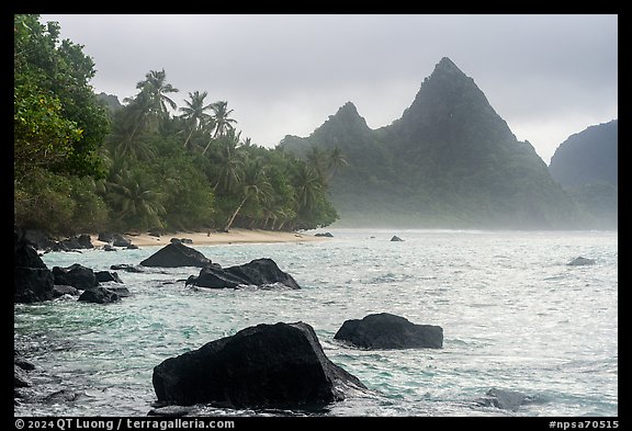 Rocks, palm trees, and Sunuitao Peak, Ofu Island. National Park of American Samoa