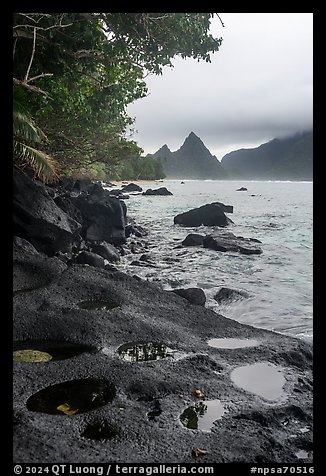 Pools on volcanic rocks and Sunuitao Peak, Ofu Island. National Park of American Samoa