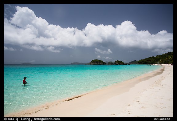 Visitor looking, Trunk Bay beach. Virgin Islands National Park (color)