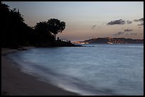 Honeymoon beach at dusk with lights of St Thomas. Virgin Islands National Park ( color)