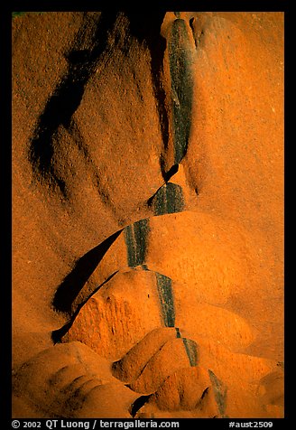 Rock sculptured by flash flood flows on Ayers Rock. Uluru-Kata Tjuta National Park, Northern Territories, Australia (color)