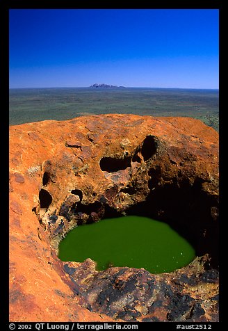 Green pool on Ayers Rock, Olgas in a distance. Uluru-Kata Tjuta National Park, Northern Territories, Australia (color)