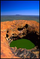 Green pool on Ayers Rock, Olgas in a distance. Uluru-Kata Tjuta National Park, Northern Territories, Australia (color)