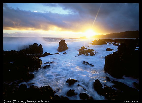 Sun and surf over rugged rocks, Kenae Peninsula. Hawaii, USA (color)