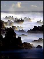 Rocks and waves at sunrise, Keanae Peninsula. Maui, Hawaii, USA