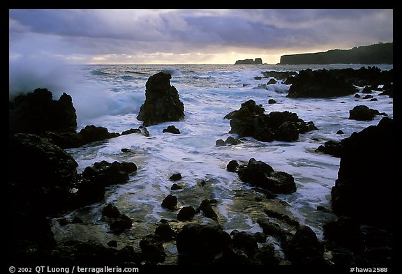Rocks and surf at sunrise, Keanae Peninsula. Maui, Hawaii, USA