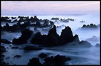 Volcanic rocks and waves at sunrise, Keanae Peninsula. Maui, Hawaii, USA